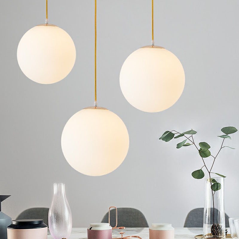 White Glass Spherical Suspension Lighting Minimalism 1 Head Ceiling Pendant Light over Table Clearhalo 'Ceiling Lights' 'Modern Pendants' 'Modern' 'Pendant Lights' 'Pendants' Lighting' 2254670