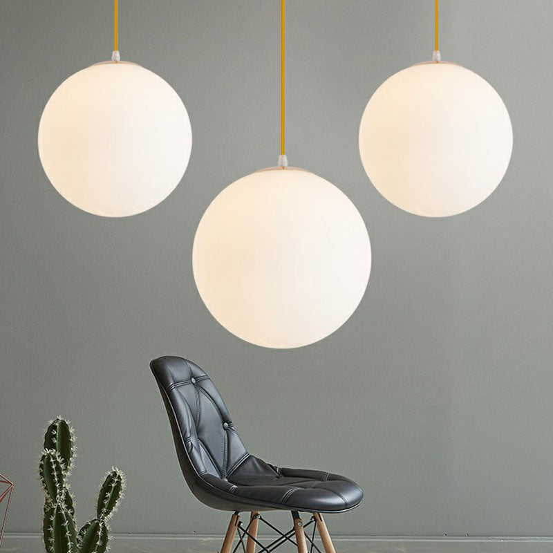 White Glass Spherical Suspension Lighting Minimalism 1 Head Ceiling Pendant Light over Table Clearhalo 'Ceiling Lights' 'Modern Pendants' 'Modern' 'Pendant Lights' 'Pendants' Lighting' 2254673