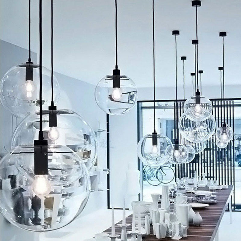 Clear Glass Globe Hanging Light Minimalistic 1-Light Black Pendant Lighting for Restaurant Clearhalo 'Ceiling Lights' 'Modern Pendants' 'Modern' 'Pendant Lights' 'Pendants' Lighting' 2254751