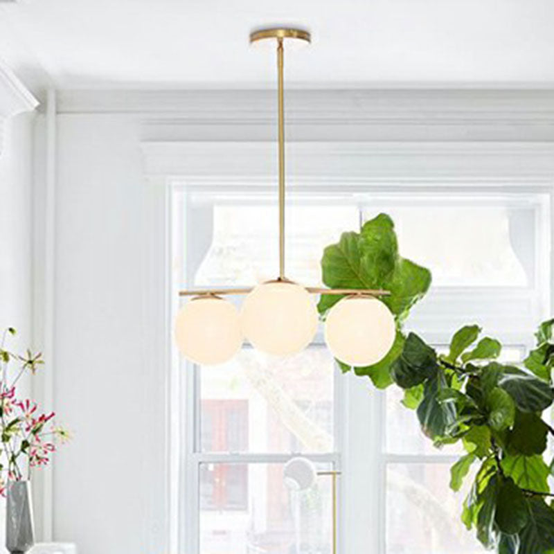 Minimalistic 3 Heads Chandelier Gold Ball Suspension Light with Cream Glass Shade Clearhalo 'Ceiling Lights' 'Chandeliers' 'Modern Chandeliers' 'Modern' Lighting' 2266219