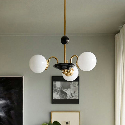 Ivory Glass Ball Chandelier Postmodern Black and Brass Hanging Lighting for Dining Room Clearhalo 'Ceiling Lights' 'Chandeliers' 'Modern Chandeliers' 'Modern' Lighting' 2269100