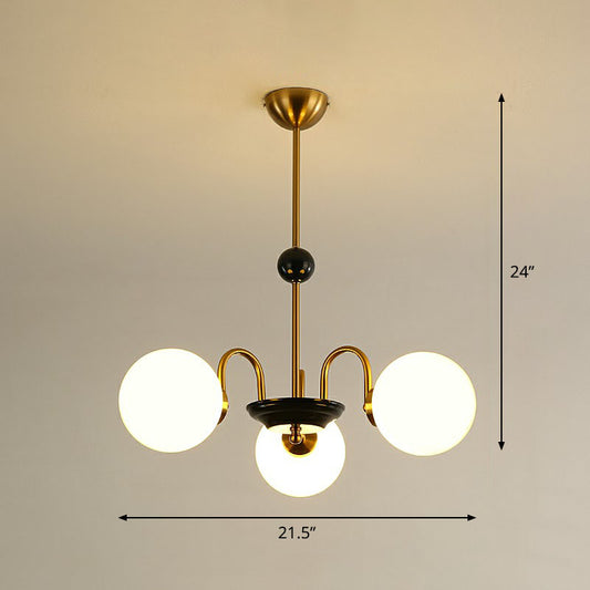 Ivory Glass Ball Chandelier Postmodern Black and Brass Hanging Lighting for Dining Room 3 Gold Clearhalo 'Ceiling Lights' 'Chandeliers' 'Modern Chandeliers' 'Modern' Lighting' 2269101