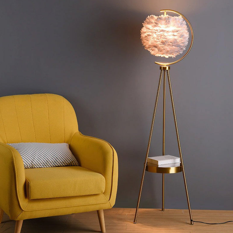 Feather lamp with gold tripod outlet stand