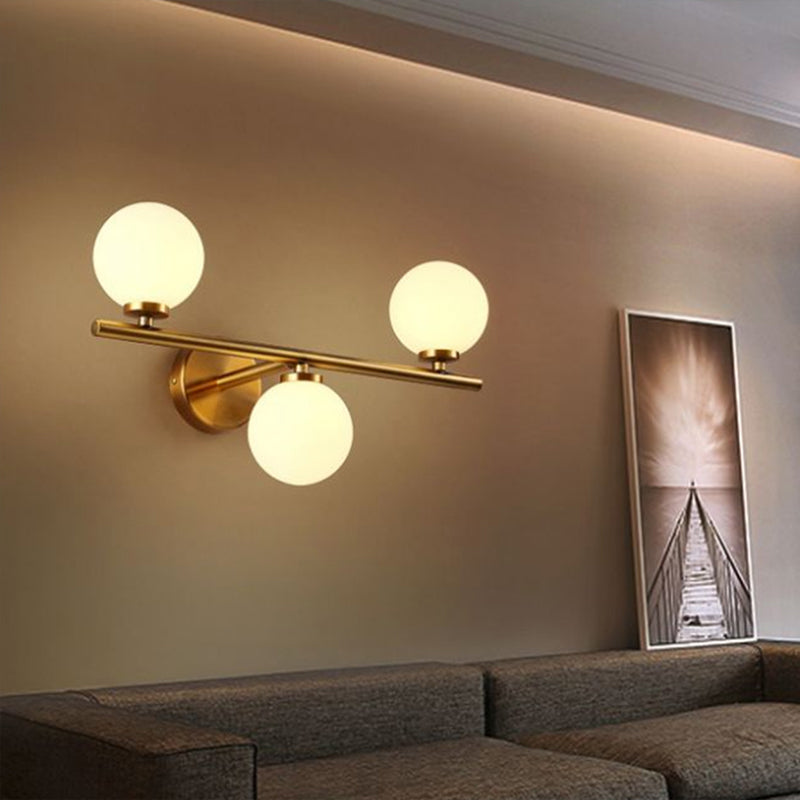 Ball Sconce Lighting Postmodern Opal Glass Corridor Wall Mounted Light Fixture in Brass Clearhalo 'Cast Iron' 'Glass' 'Industrial' 'Modern wall lights' 'Modern' 'Tiffany' 'Traditional wall lights' 'Wall Lamps & Sconces' 'Wall Lights' Lighting' 2283199