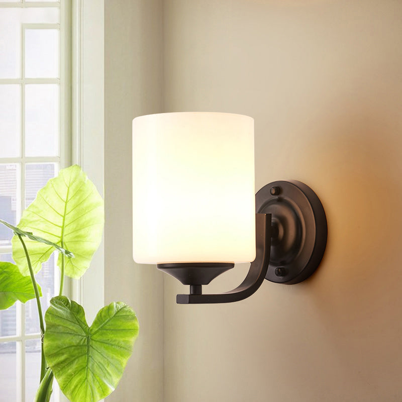 Single-Bulb Wall Sconce Simplicity Cylinder White Glass Wall Light Fixture in Black Clearhalo 'Wall Lamps & Sconces' 'Wall Lights' Lighting' 2311626