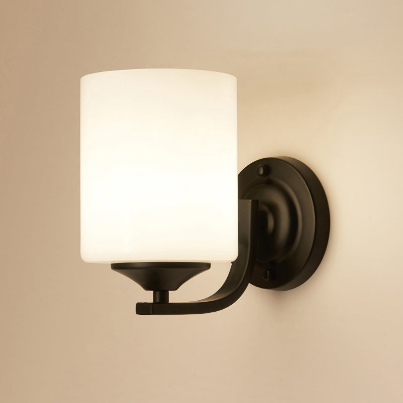 Single-Bulb Wall Sconce Simplicity Cylinder White Glass Wall Light Fixture in Black Clearhalo 'Wall Lamps & Sconces' 'Wall Lights' Lighting' 2311627