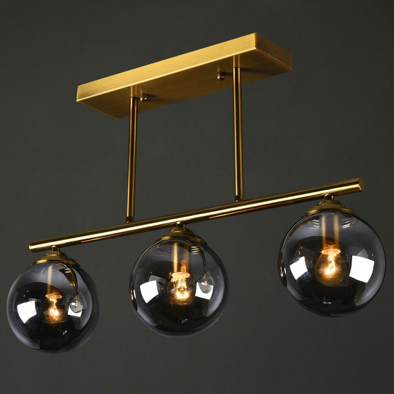 Brass Linear Island Light Fixture Postmodern Metal Ceiling Light with Globe Glass Shade 3 Smoke Gray Clearhalo 'Ceiling Lights' 'Island Lights' Lighting' 2354394