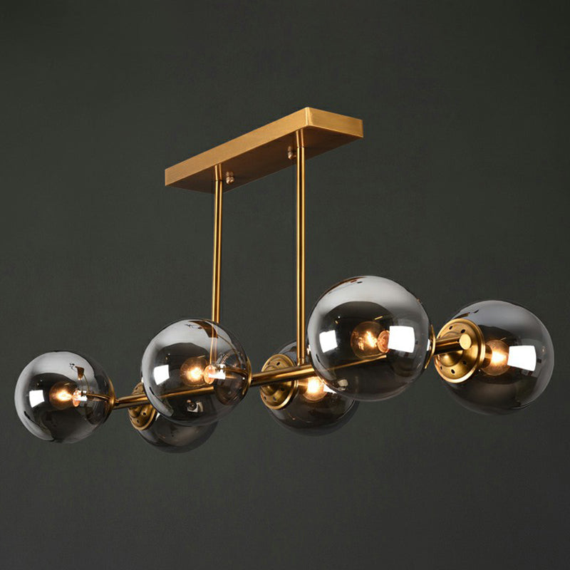 Brass Linear Island Light Fixture Postmodern Metal Ceiling Light with Globe Glass Shade Clearhalo 'Ceiling Lights' 'Island Lights' Lighting' 2354396