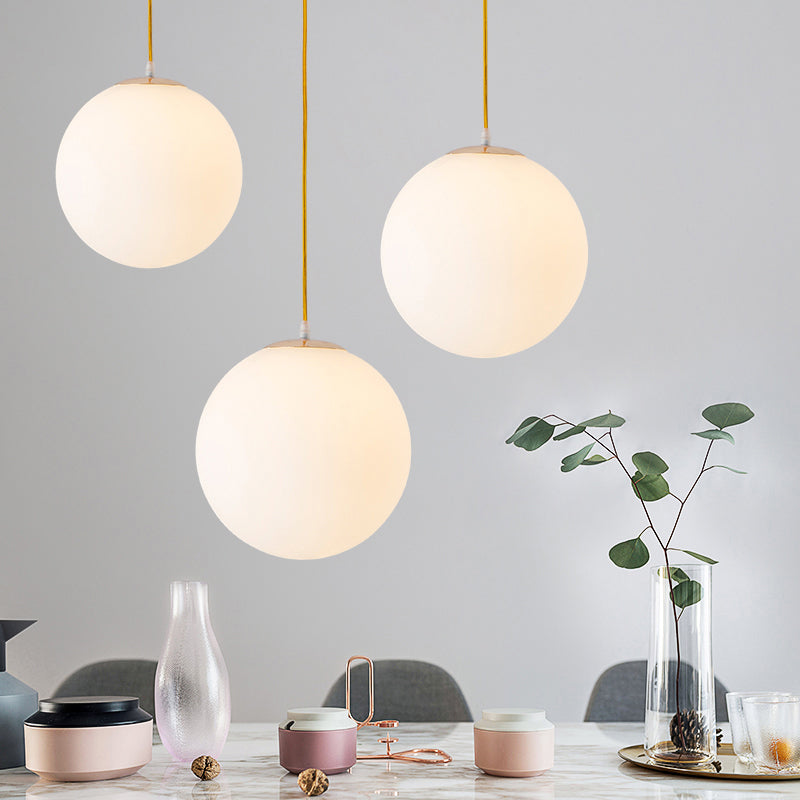 Globe Milky Glass Hanging Lamp Minimalistic 1-Light Gold Pendant Light for Dining Room Gold Clearhalo 'Ceiling Lights' 'Modern Pendants' 'Modern' 'Pendant Lights' 'Pendants' Lighting' 2356904