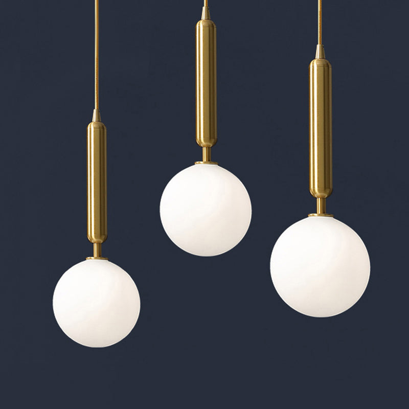 3 Lights Dining Room Multi Ceiling Light Postmodern Brass Pendant with Ball Glass Shade Cream 12" Clearhalo 'Ceiling Lights' 'Modern Pendants' 'Modern' 'Pendant Lights' 'Pendants' Lighting' 2357036