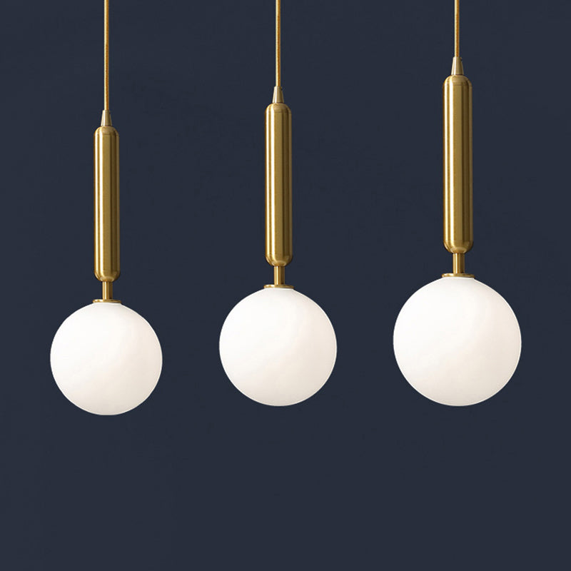 3 Lights Dining Room Multi Ceiling Light Postmodern Brass Pendant with Ball Glass Shade Cream 21.5" Clearhalo 'Ceiling Lights' 'Modern Pendants' 'Modern' 'Pendant Lights' 'Pendants' Lighting' 2357039