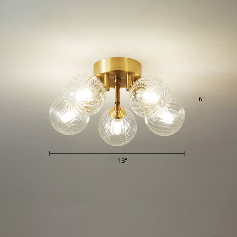 Post-Modern Ball Semi Mount Lighting Clear Twist Glass Dining Room Flush Ceiling Light in Brass 5 Brass Clearhalo 'Ceiling Lights' 'Close To Ceiling Lights' 'Close to ceiling' 'Semi-flushmount' Lighting' 2357081