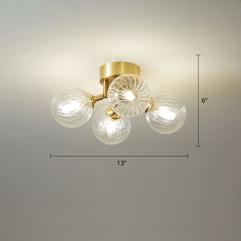 Post-Modern Ball Semi Mount Lighting Clear Twist Glass Dining Room Flush Ceiling Light in Brass 4 Brass Clearhalo 'Ceiling Lights' 'Close To Ceiling Lights' 'Close to ceiling' 'Semi-flushmount' Lighting' 2357083