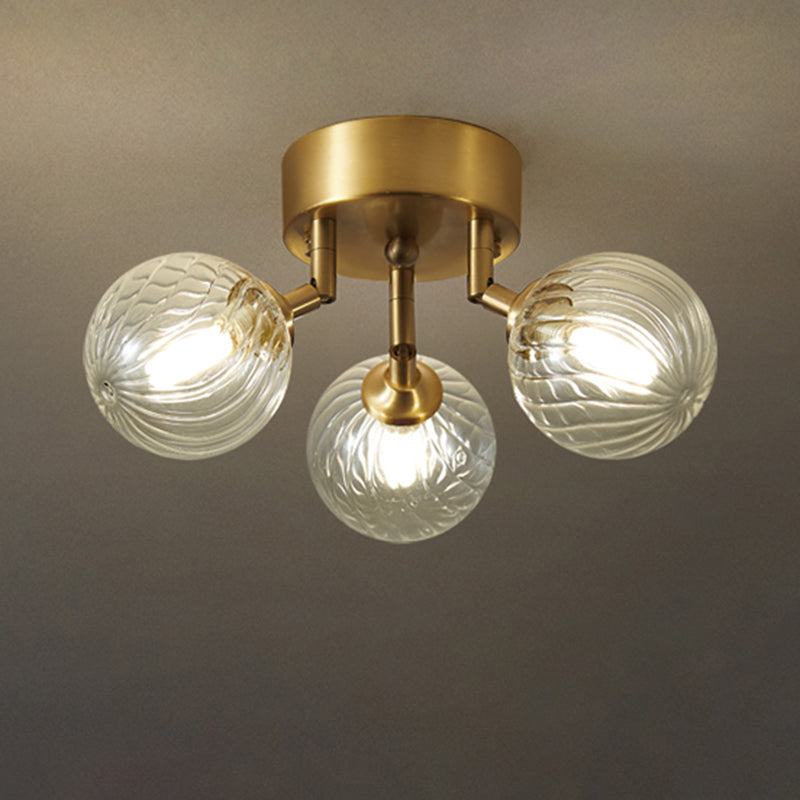 Post-Modern Ball Semi Mount Lighting Clear Twist Glass Dining Room Flush Ceiling Light in Brass 3 Brass Clearhalo 'Ceiling Lights' 'Close To Ceiling Lights' 'Close to ceiling' 'Semi-flushmount' Lighting' 2357084