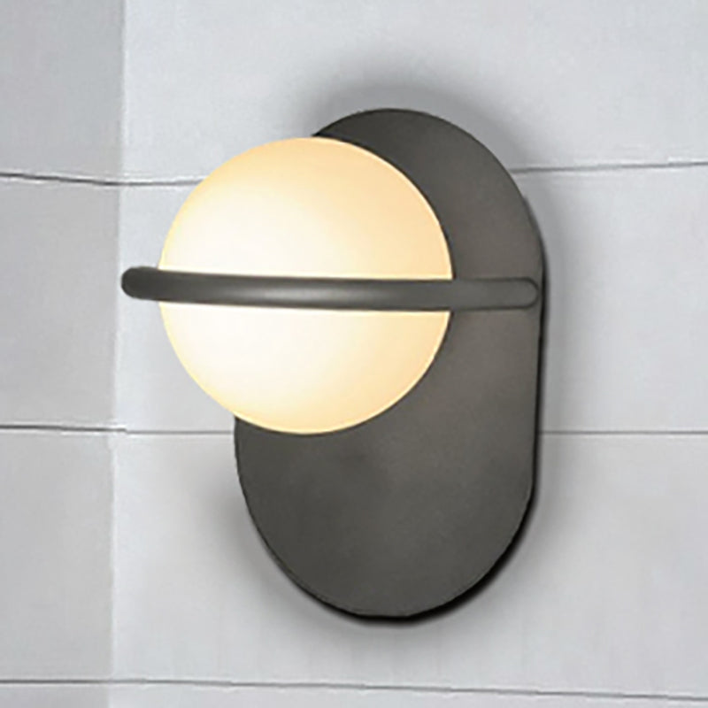 Modernist Orb Wall Light Milk Glass 1 Bulb Bedroom Sconce Lighting with Oval Metal Backplate in Black/Gold Clearhalo 'Cast Iron' 'Glass' 'Industrial' 'Modern wall lights' 'Modern' 'Tiffany' 'Traditional wall lights' 'Wall Lamps & Sconces' 'Wall Lights' Lighting' 236040
