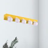 Metal Linear Vanity Sconce Light with Bare Bulb Macaron Style 5 Lights Wall Sconce in Pink/Yellow Yellow Clearhalo 'Cast Iron' 'Glass' 'Industrial' 'Modern wall lights' 'Modern' 'Tiffany' 'Traditional wall lights' 'Vanity Lights' 'Wall Lights' Lighting' 236098