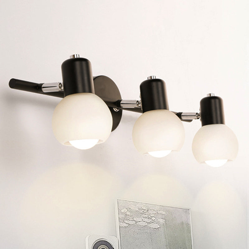 Globe Living Room Vanity Sconce Light Metal and Milk Glass 2/3 Lights Contemporary Wall Light Fixture in Black Clearhalo 'Cast Iron' 'Glass' 'Industrial' 'Modern wall lights' 'Modern' 'Tiffany' 'Traditional wall lights' 'Vanity Lights' 'Wall Lights' Lighting' 236573