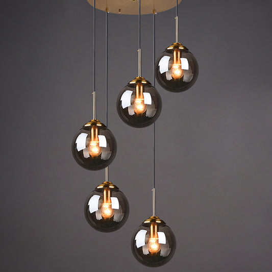 Brass Finish Cluster Ball Pendant Post-Modern 5 Bulbs Glass Suspended Lighting Fixture Smoke Gray Globe Clearhalo 'Ceiling Lights' 'Modern Pendants' 'Modern' 'Pendant Lights' 'Pendants' Lighting' 2384744