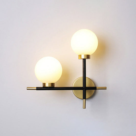 Mini Globe Milk Glass Wall Mount Light Modern 2-Light Black Sconce Fixture for Foyer Black Left Clearhalo 'Cast Iron' 'Glass' 'Industrial' 'Modern wall lights' 'Modern' 'Tiffany' 'Traditional wall lights' 'Wall Lamps & Sconces' 'Wall Lights' Lighting' 2423038