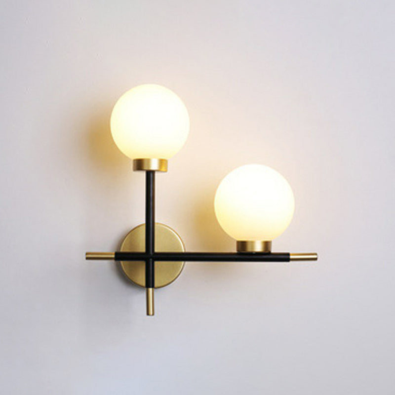 Mini Globe Milk Glass Wall Mount Light Modern 2-Light Black Sconce Fixture for Foyer Black Right Clearhalo 'Cast Iron' 'Glass' 'Industrial' 'Modern wall lights' 'Modern' 'Tiffany' 'Traditional wall lights' 'Wall Lamps & Sconces' 'Wall Lights' Lighting' 2423039