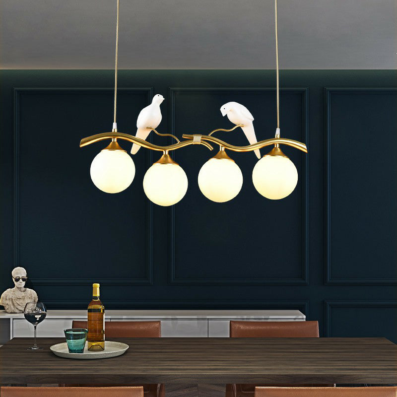 Minimalist Branch Island Lighting Metal 4-Light Dining Room Pendant Light with Ball Glass Shade and Bird Deco Gold Milk White Clearhalo 'Ceiling Lights' 'Island Lights' Lighting' 2423078