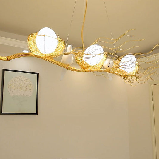 Artistic 3-Light Hanging Light Beige Nest and Egg Island Light Fixture with Cream Glass Shade Beige Bird Clearhalo 'Ceiling Lights' 'Chandeliers' 'Glass shade' 'Glass' 'Island Lights' 'Pendant Lights' Lighting' 2423222
