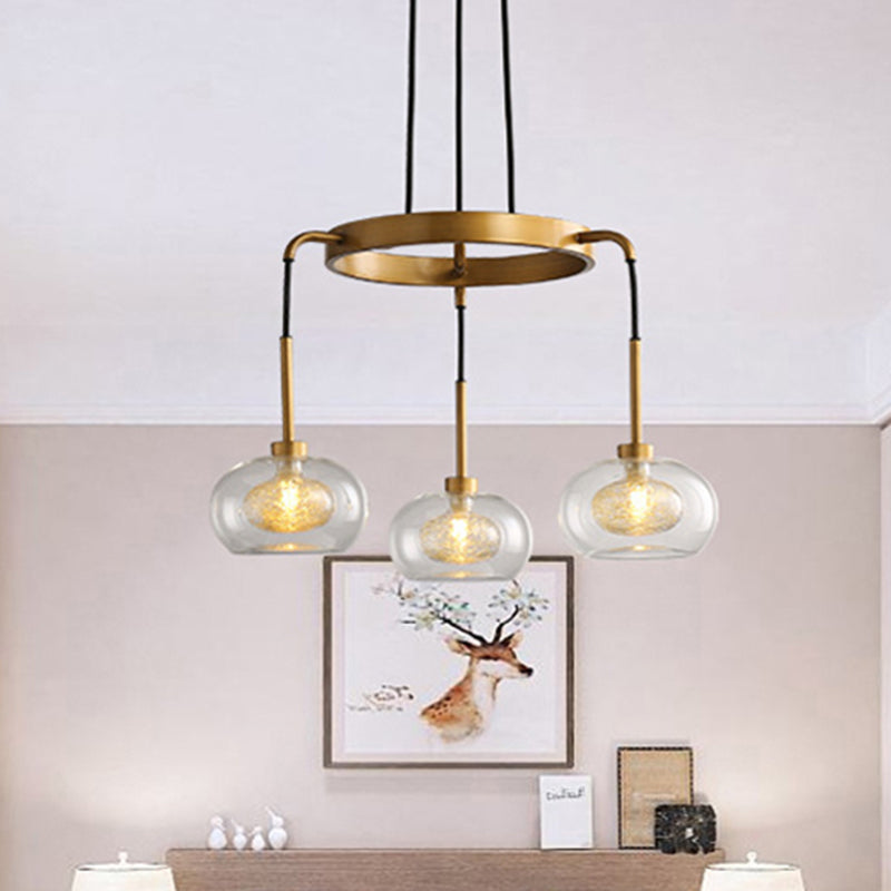 Gold Oval Chandelier Lighting Post-Modern 3 Lights Clear Glass Led Pendant Light Fixture with Ring Design Clearhalo 'Ceiling Lights' 'Chandeliers' 'Glass shade' 'Glass' 'Modern Chandeliers' 'Modern' Lighting' 243812