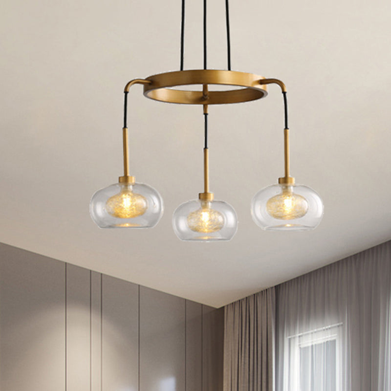 Gold Oval Chandelier Lighting Post-Modern 3 Lights Clear Glass Led Pendant Light Fixture with Ring Design Clearhalo 'Ceiling Lights' 'Chandeliers' 'Glass shade' 'Glass' 'Modern Chandeliers' 'Modern' Lighting' 243813