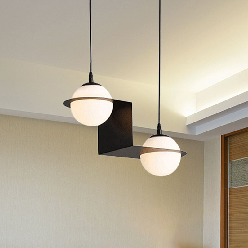 Ball White Glass Cluster Pendant with Straight/Curved Design Modernist 2/3 Lights Black Led Hanging Lamp Clearhalo 'Ceiling Lights' 'Glass shade' 'Glass' 'Modern Pendants' 'Modern' 'Pendant Lights' 'Pendants' Lighting' 244465