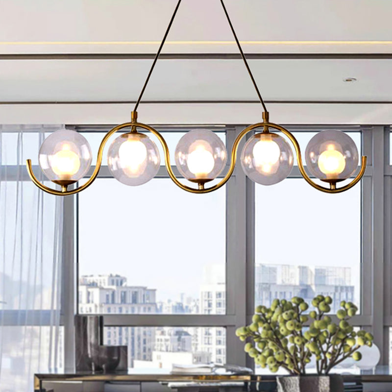 3/5/7 Lights Living Room Chandelier with Ball Clear Glass Shade Post Modernist Gold Led Hanging Ceiling Light 5 Gold Clearhalo 'Ceiling Lights' 'Chandeliers' 'Glass shade' 'Glass' 'Modern Chandeliers' 'Modern' Lighting' 245627