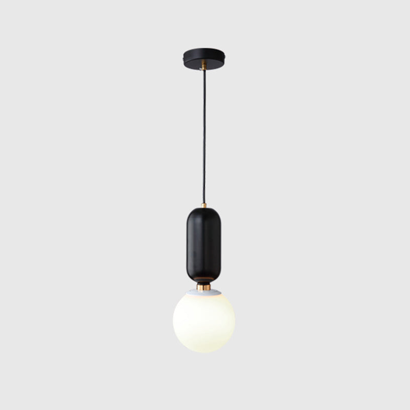 Milky Glass Ball Suspension Lamp Simplicity 1-Bulb Pendant Lighting Fixture for Living Room Black 6.5" Clearhalo 'Ceiling Lights' 'Glass shade' 'Glass' 'Modern Pendants' 'Modern' 'Pendant Lights' 'Pendants' Lighting' 2460608