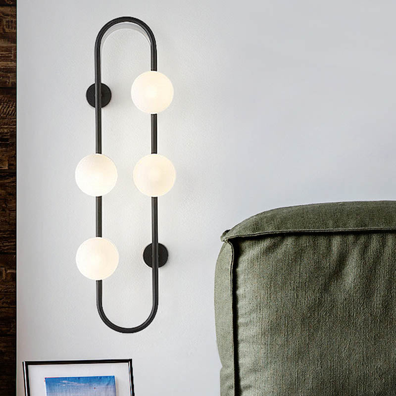 Modern Globe Wall Sconce Matte White Glass 4-Light Bedroom Wall Lighting Ideas in Black/Gold with Oblong Hanging Rod Black Clearhalo 'Cast Iron' 'Glass' 'Industrial' 'Modern wall lights' 'Modern' 'Tiffany' 'Traditional wall lights' 'Wall Lamps & Sconces' 'Wall Lights' Lighting' 246263