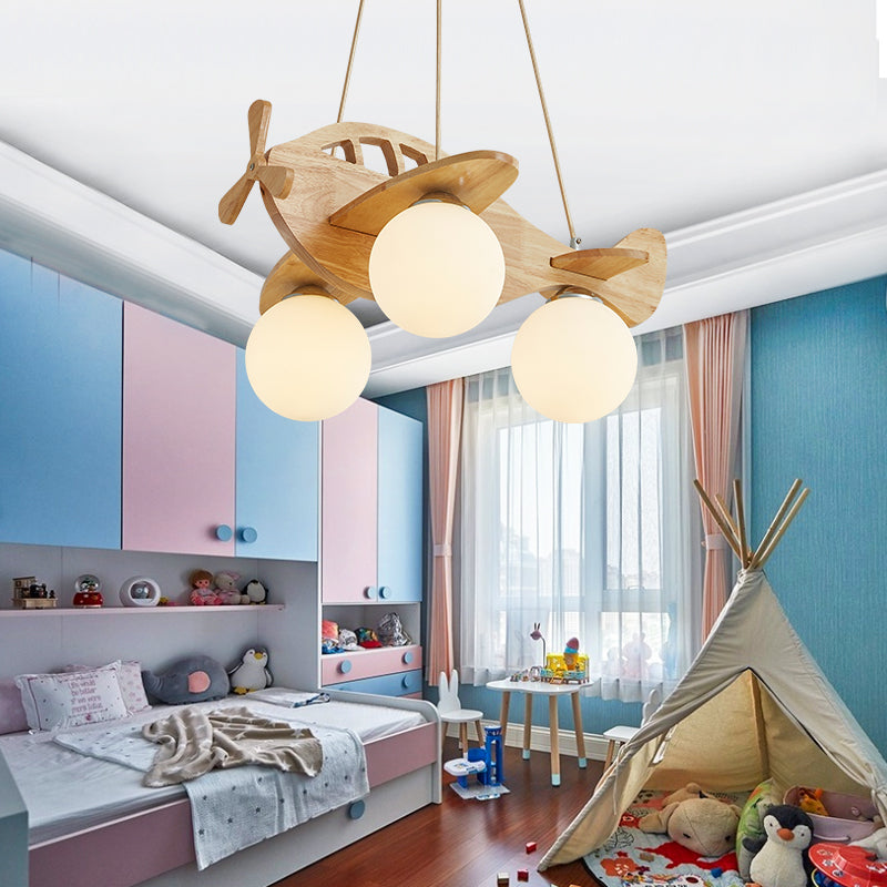 Cartoon Aircraft Pendant Chandelier Wooden 3-Bulb Kids Room Hanging Light with Ball White Glass Shade Wood Clearhalo 'Ceiling Lights' 'Pendant Lights' 'Pendants' Lighting' 2463011