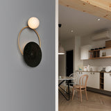 Postmodern Creative Circle Wall Sconce Cream Glass 1 Head Corridor Wall Light in Black-Brass Clearhalo 'Cast Iron' 'Glass' 'Industrial' 'Modern wall lights' 'Modern' 'Tiffany' 'Traditional wall lights' 'Wall Lamps & Sconces' 'Wall Lights' Lighting' 2466926