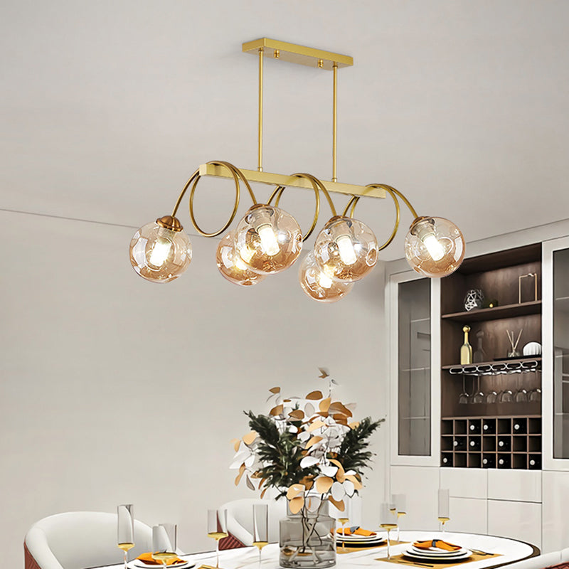 Gold Finish Spiral Island Light Post-Modern Metal Ceiling Hang Lamp with Ball Dimpled Glass Shade 6 Gold Amber Clearhalo 'Ceiling Lights' 'Island Lights' Lighting' 2468068
