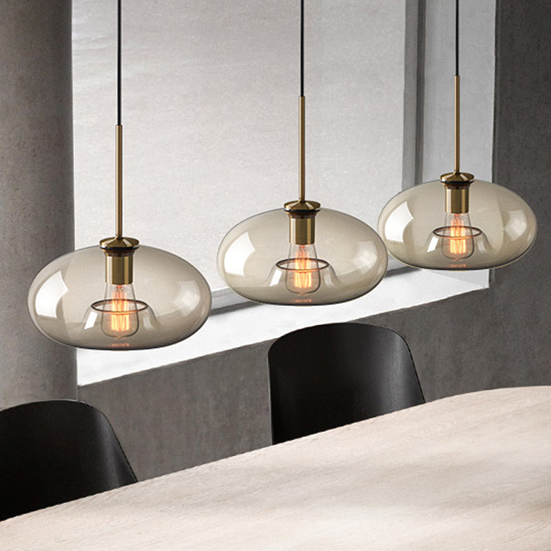 1 Light Dining Room Suspension Lamp with Oval/Drum/Cylinder Clear Glass Shade Contemporary Brass Ceiling Pendant Light, 7"/10"/11" Wide Clearhalo 'Ceiling Lights' 'Glass shade' 'Glass' 'Modern Pendants' 'Modern' 'Pendant Lights' 'Pendants' Lighting' 247073