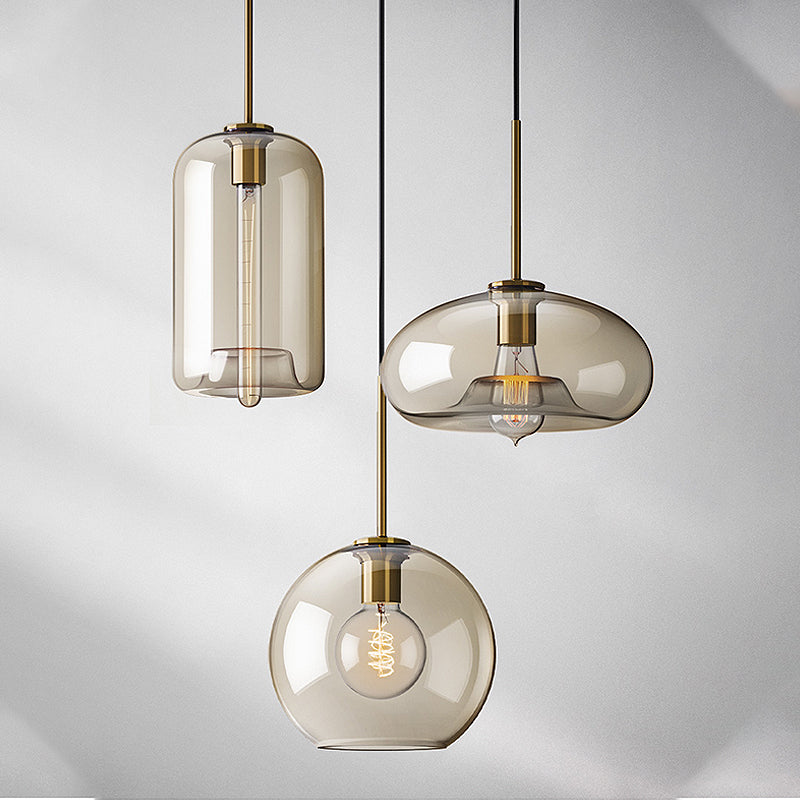 1 Light Dining Room Suspension Lamp with Oval/Drum/Cylinder Clear Glass Shade Contemporary Brass Ceiling Pendant Light, 7"/10"/11" Wide Clearhalo 'Ceiling Lights' 'Glass shade' 'Glass' 'Modern Pendants' 'Modern' 'Pendant Lights' 'Pendants' Lighting' 247076