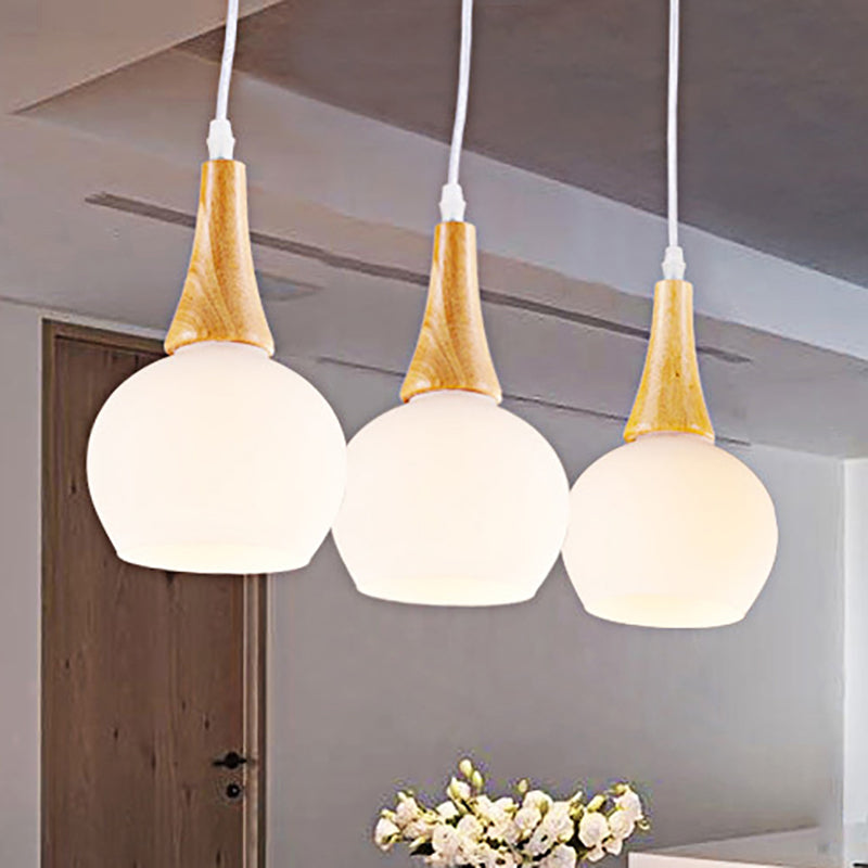 3 Heads Global Pendant Lamp Modernist White Glass and Wood Ceiling Light Fixture for Dining Table Clearhalo 'Ceiling Lights' 'Close To Ceiling Lights' 'Glass shade' 'Glass' 'Modern Pendants' 'Modern' 'Pendant Lights' 'Pendants' Lighting' 249550