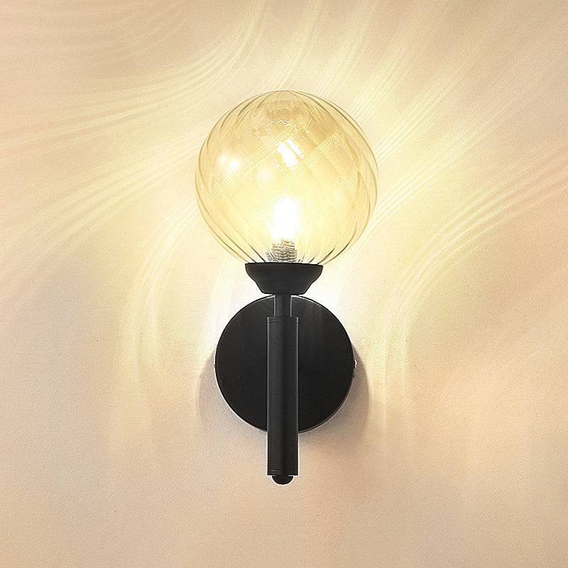 Modern Globe Wall Lighting Fixture 1 Bulb Clear Textured Glass Sconce Light in Black Clearhalo 'Cast Iron' 'Glass' 'Industrial' 'Modern wall lights' 'Modern' 'Tiffany' 'Traditional wall lights' 'Wall Lamps & Sconces' 'Wall Lights' Lighting' 250609
