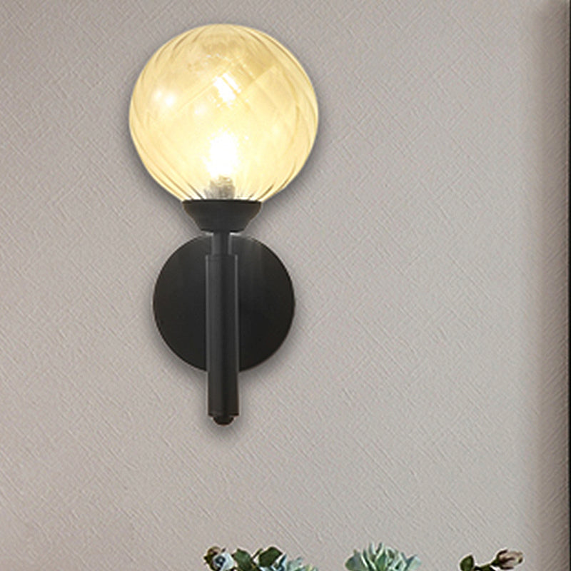 Modern Globe Wall Lighting Fixture 1 Bulb Clear Textured Glass Sconce Light in Black Clearhalo 'Cast Iron' 'Glass' 'Industrial' 'Modern wall lights' 'Modern' 'Tiffany' 'Traditional wall lights' 'Wall Lamps & Sconces' 'Wall Lights' Lighting' 250610