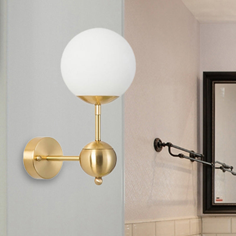 Modern Globe Wall Lighting Fixture 1 Bulb White Glass Sconce Light in Brass for Bathroom White Clearhalo 'Cast Iron' 'Glass' 'Industrial' 'Modern wall lights' 'Modern' 'Tiffany' 'Traditional wall lights' 'Wall Lamps & Sconces' 'Wall Lights' Lighting' 250620