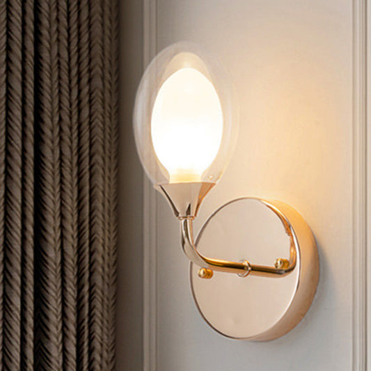 Modern Oval Shade Wall Lighting 1 Bulb Clear Glass Sconce Light in Brass for Dining Room Brass Clearhalo 'Cast Iron' 'Glass' 'Industrial' 'Modern wall lights' 'Modern' 'Tiffany' 'Traditional wall lights' 'Wall Lamps & Sconces' 'Wall Lights' Lighting' 253383