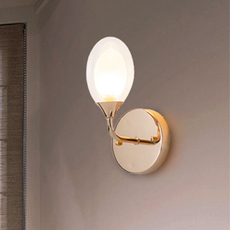 Modern Oval Shade Wall Lighting 1 Bulb Clear Glass Sconce Light in Brass for Dining Room Clearhalo 'Cast Iron' 'Glass' 'Industrial' 'Modern wall lights' 'Modern' 'Tiffany' 'Traditional wall lights' 'Wall Lamps & Sconces' 'Wall Lights' Lighting' 253384