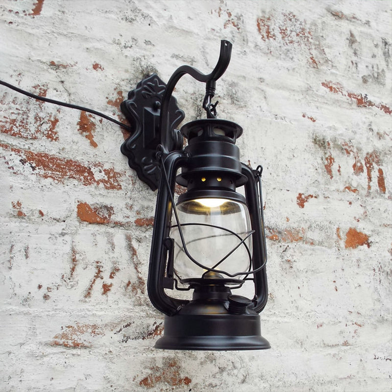 Clear Glass Black/Antique Brass Wall Sconce Lighting Lantern 1-Light Coastal Light Fixture for Porch Clearhalo 'Art deco wall lights' 'Cast Iron' 'Glass' 'Industrial wall lights' 'Industrial' 'Middle century wall lights' 'Modern' 'Rustic wall lights' 'Tiffany' 'Traditional wall lights' 'Wall Lamps & Sconces' 'Wall Lights' Lighting' 253698