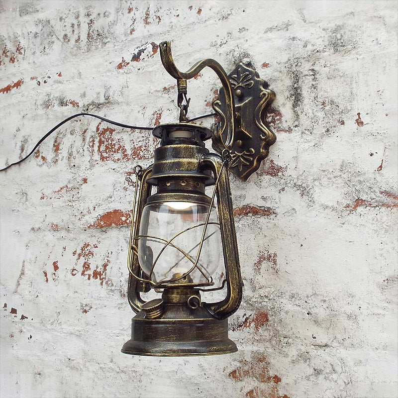 Clear Glass Black/Antique Brass Wall Sconce Lighting Lantern 1-Light Coastal Light Fixture for Porch Clearhalo 'Art deco wall lights' 'Cast Iron' 'Glass' 'Industrial wall lights' 'Industrial' 'Middle century wall lights' 'Modern' 'Rustic wall lights' 'Tiffany' 'Traditional wall lights' 'Wall Lamps & Sconces' 'Wall Lights' Lighting' 253700