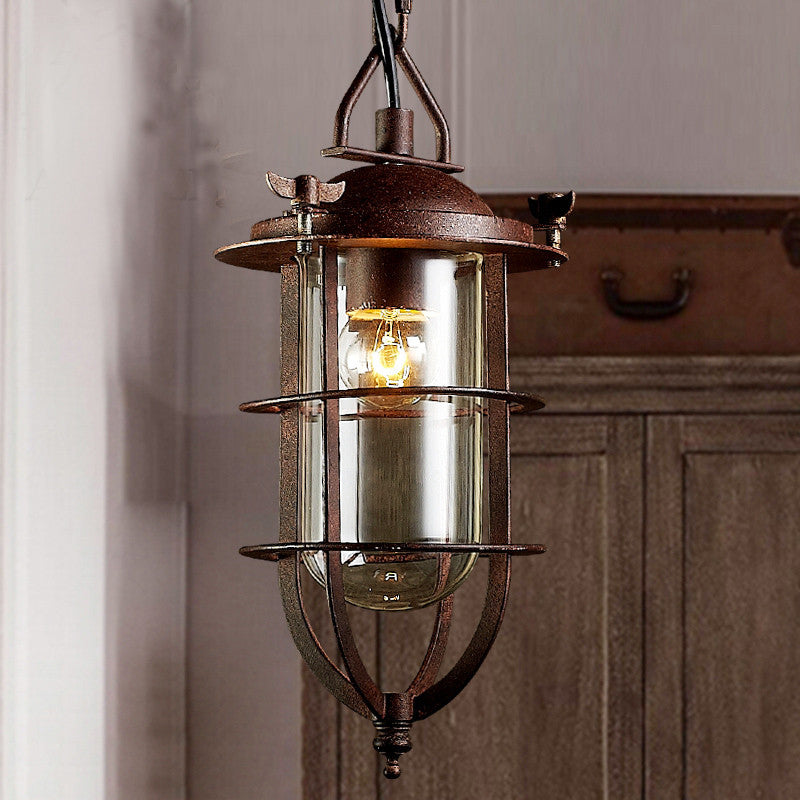 Rust Caged Lantern Pendant Fixture Coastal Clear Glass Single-Bulb Living Room Hanging Ceiling Light Rust Clearhalo 'Ceiling Lights' 'Close To Ceiling Lights' 'Glass shade' 'Glass' 'Industrial Pendants' 'Industrial' 'Middle Century Pendants' 'Pendant Lights' 'Pendants' 'Tiffany' Lighting' 254131