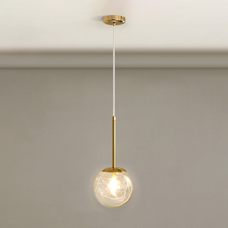 Spherical Glass Hanging Ceiling Light Modern 1 Light Bedroom Pendant Lamp in Gold Gold 5.5" Linear Clearhalo 'Ceiling Lights' 'Glass shade' 'Glass' 'Modern Pendants' 'Modern' 'Pendant Lights' 'Pendants' Lighting' 2548934