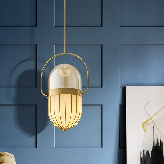 Postmodern Pill Capsule Pendant Lamp Clear and White Glass 1 Head Dining Room Hanging Ceiling Light in Gold Brass Clearhalo 'Ceiling Lights' 'Glass shade' 'Glass' 'Modern Pendants' 'Modern' 'Pendant Lights' 'Pendants' Lighting' 257573