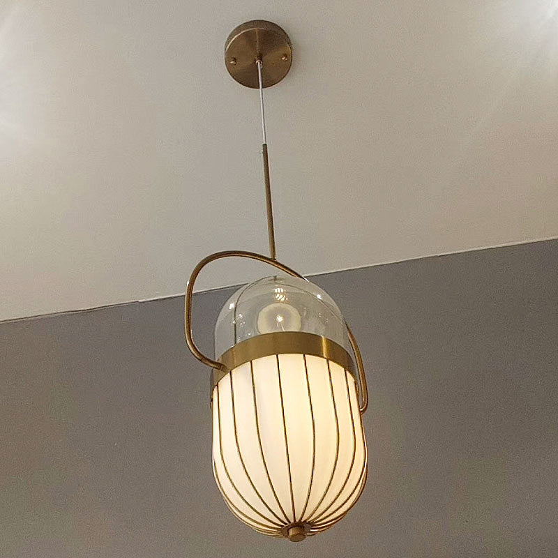 Postmodern Pill Capsule Pendant Lamp Clear and White Glass 1 Head Dining Room Hanging Ceiling Light in Gold Clearhalo 'Ceiling Lights' 'Glass shade' 'Glass' 'Modern Pendants' 'Modern' 'Pendant Lights' 'Pendants' Lighting' 257575