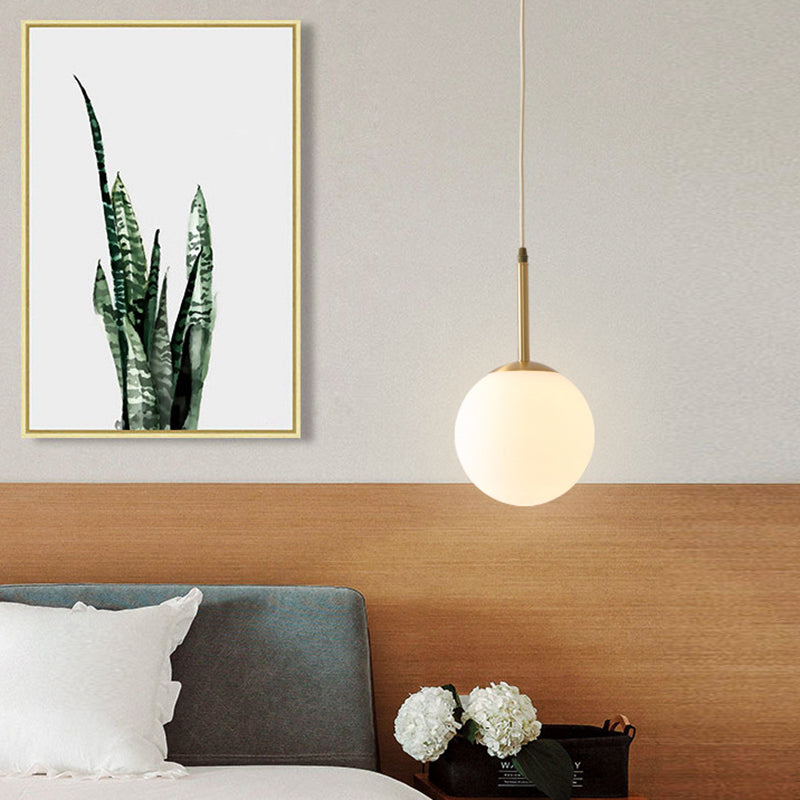 Brass 1-Light Pendant Light Mid-Century Modern Spherical White Glass Hanging Lamp Clearhalo 'Ceiling Lights' 'Glass shade' 'Glass' 'Modern Pendants' 'Modern' 'Pendant Lights' 'Pendants' Lighting' 2579342